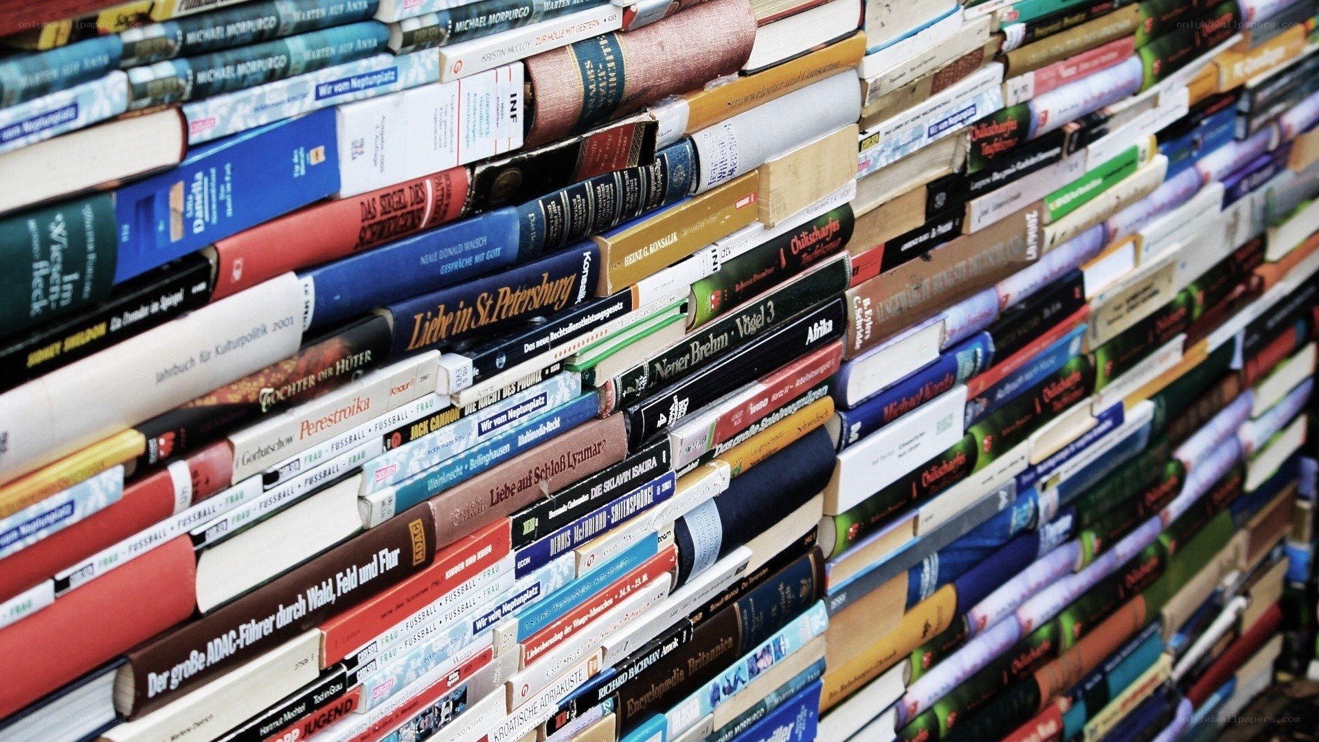 stacked books in a library