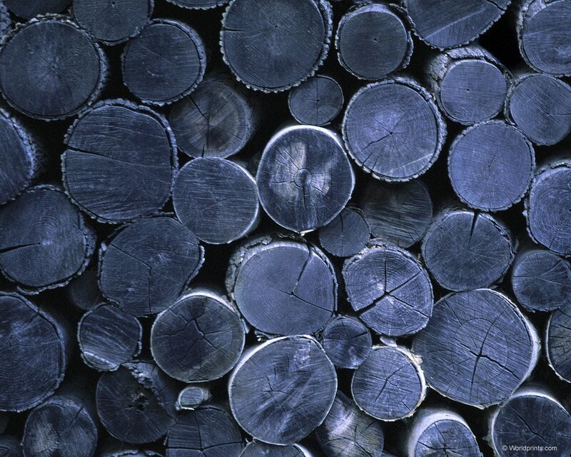 stacked charcoal logs