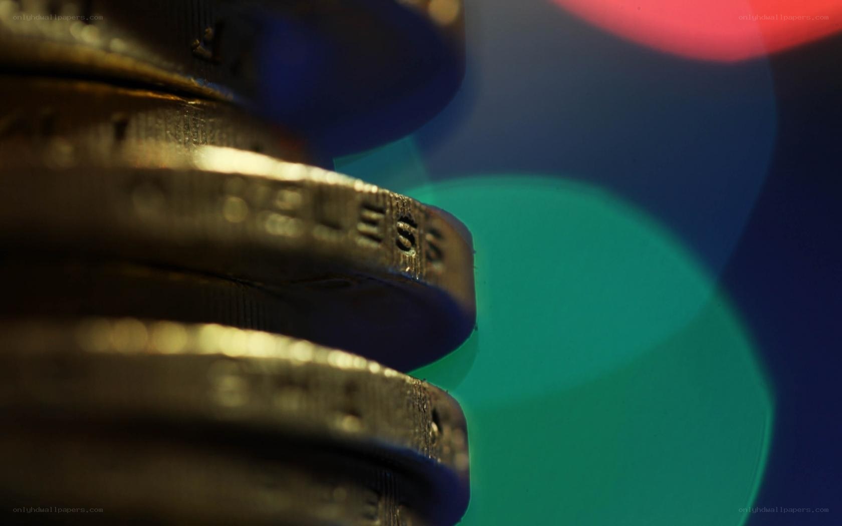 stacked coins with colorful lights
