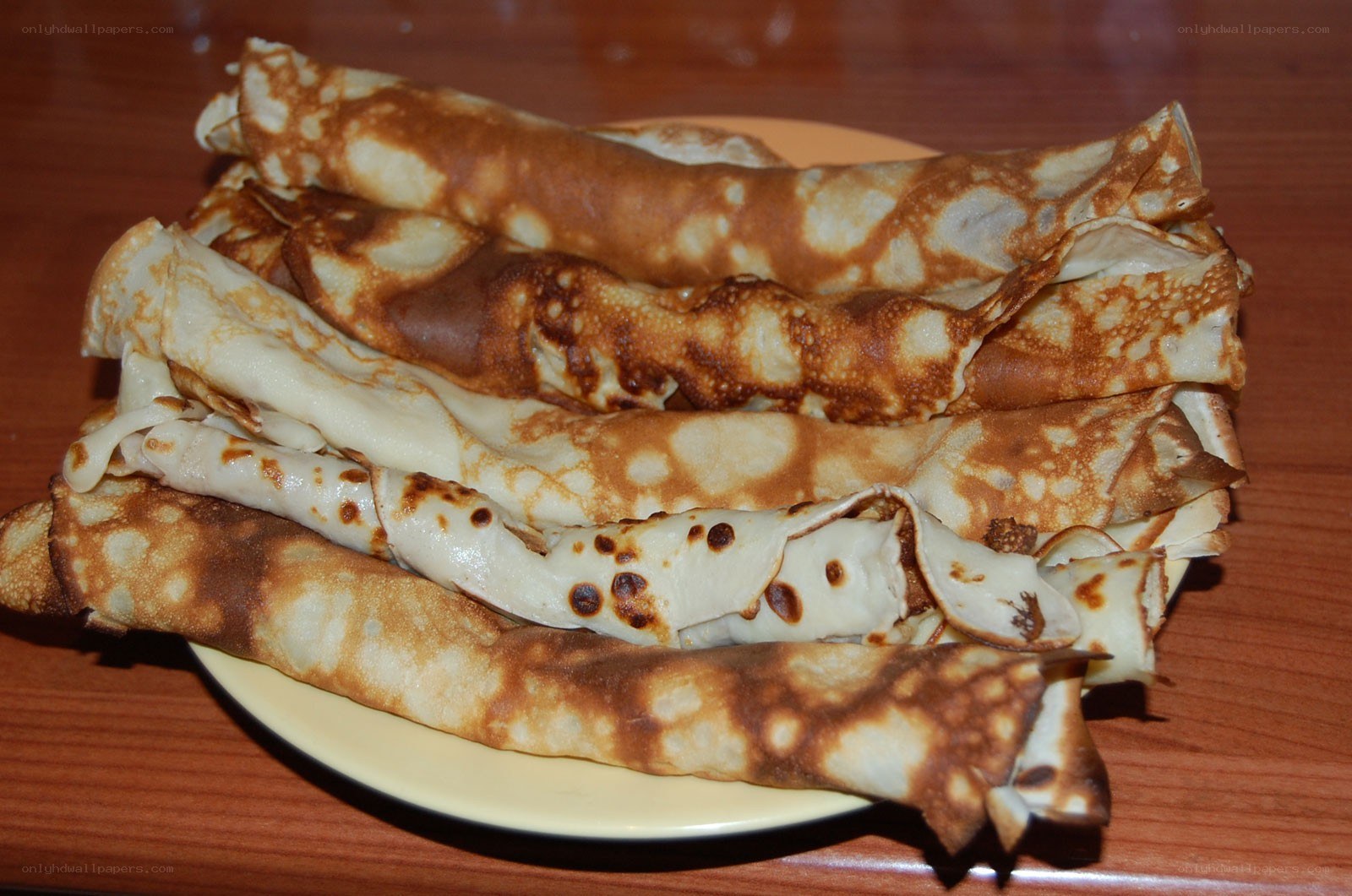 stacked crepes on a plate