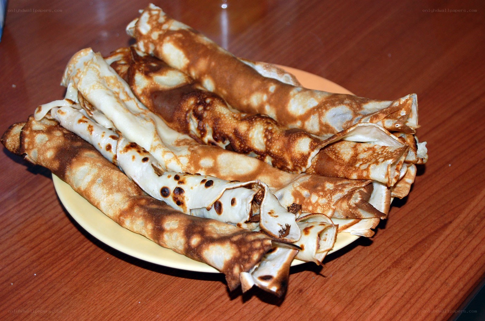 stacked crepes on a plate