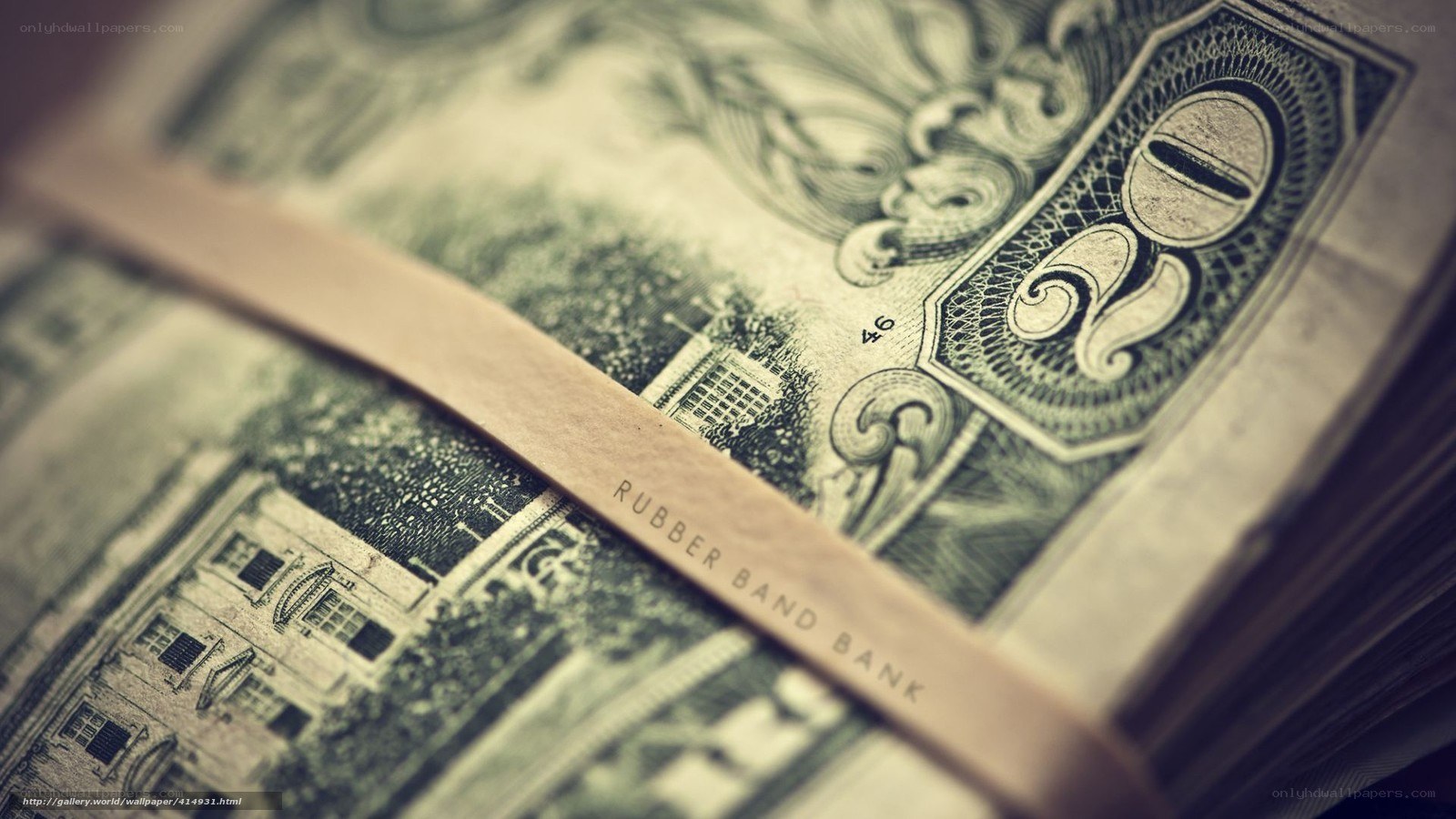 stacked dollar bills with rubber band