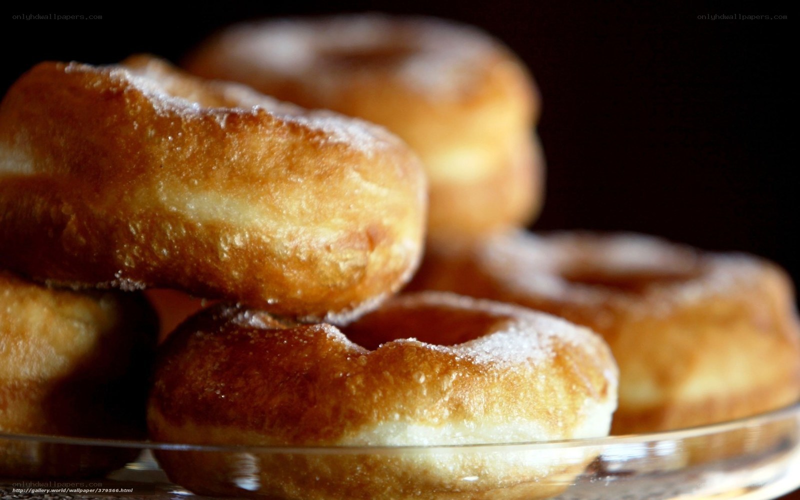 stacked donuts on glass plate