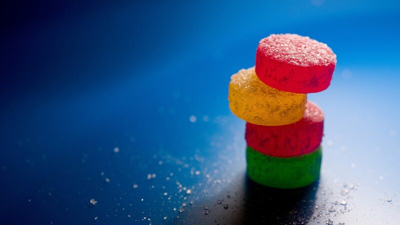Stacked Gummy Candies — Blue, Vibrant, Photograph, Sugar Crystals, Blue Surface, Red