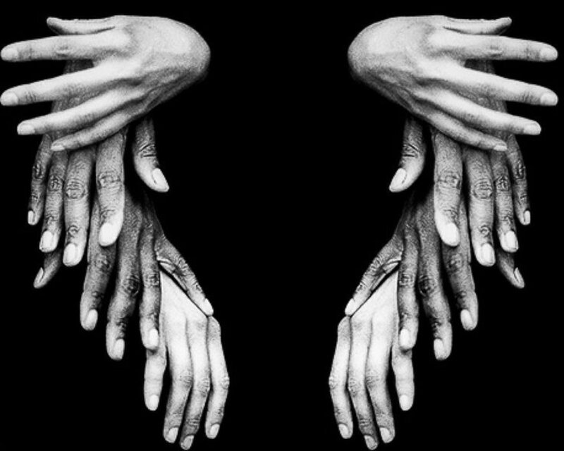 Stacked Hands in Black and White
