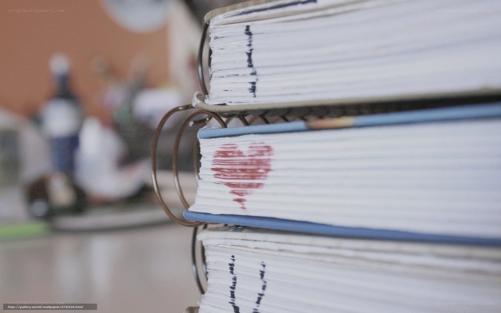 stacked notebooks with heart