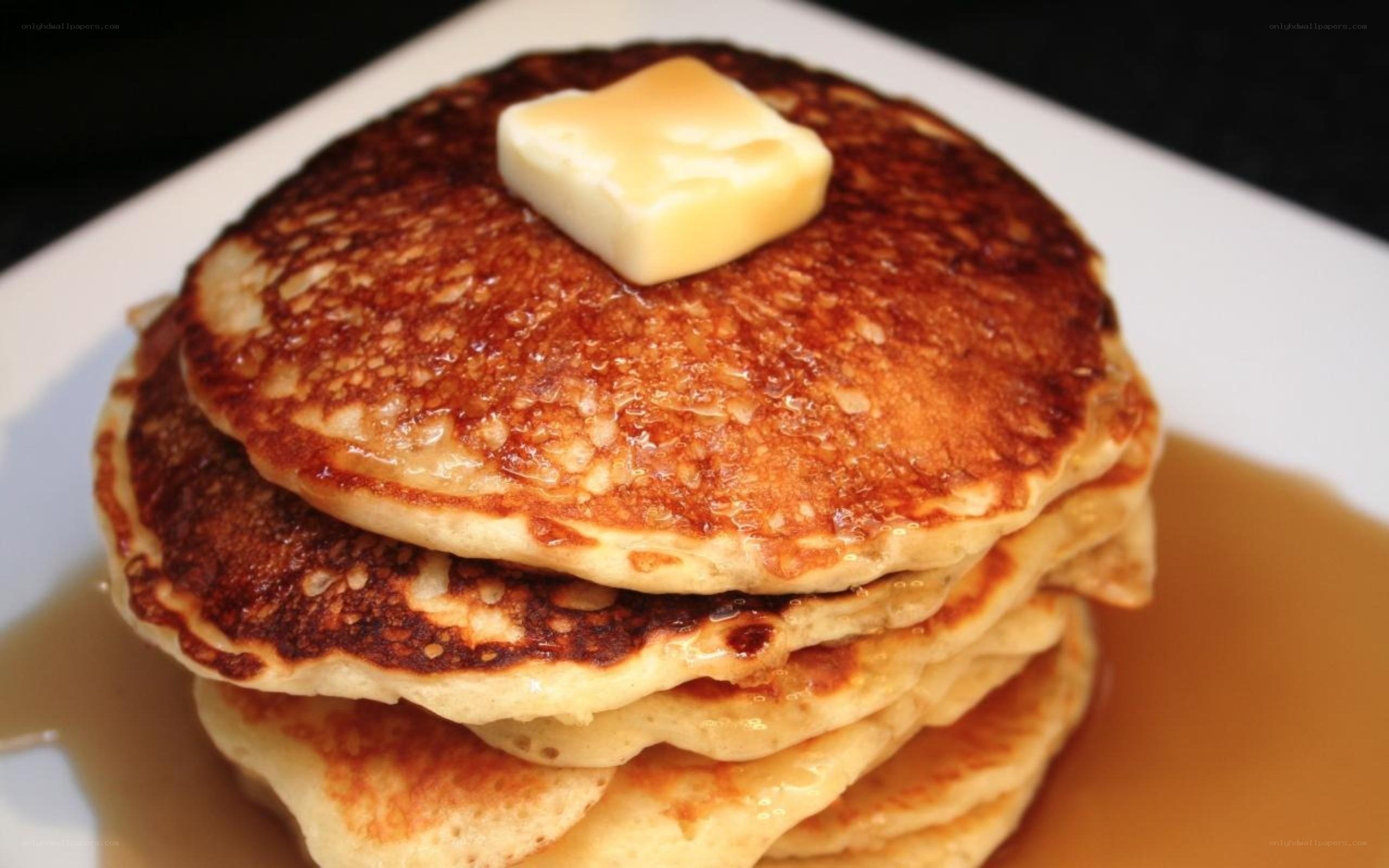 stacked pancakes with butter