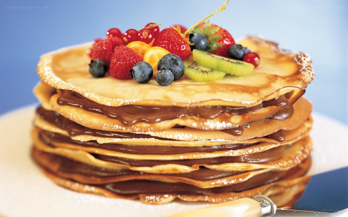 stacked pancakes with fruit