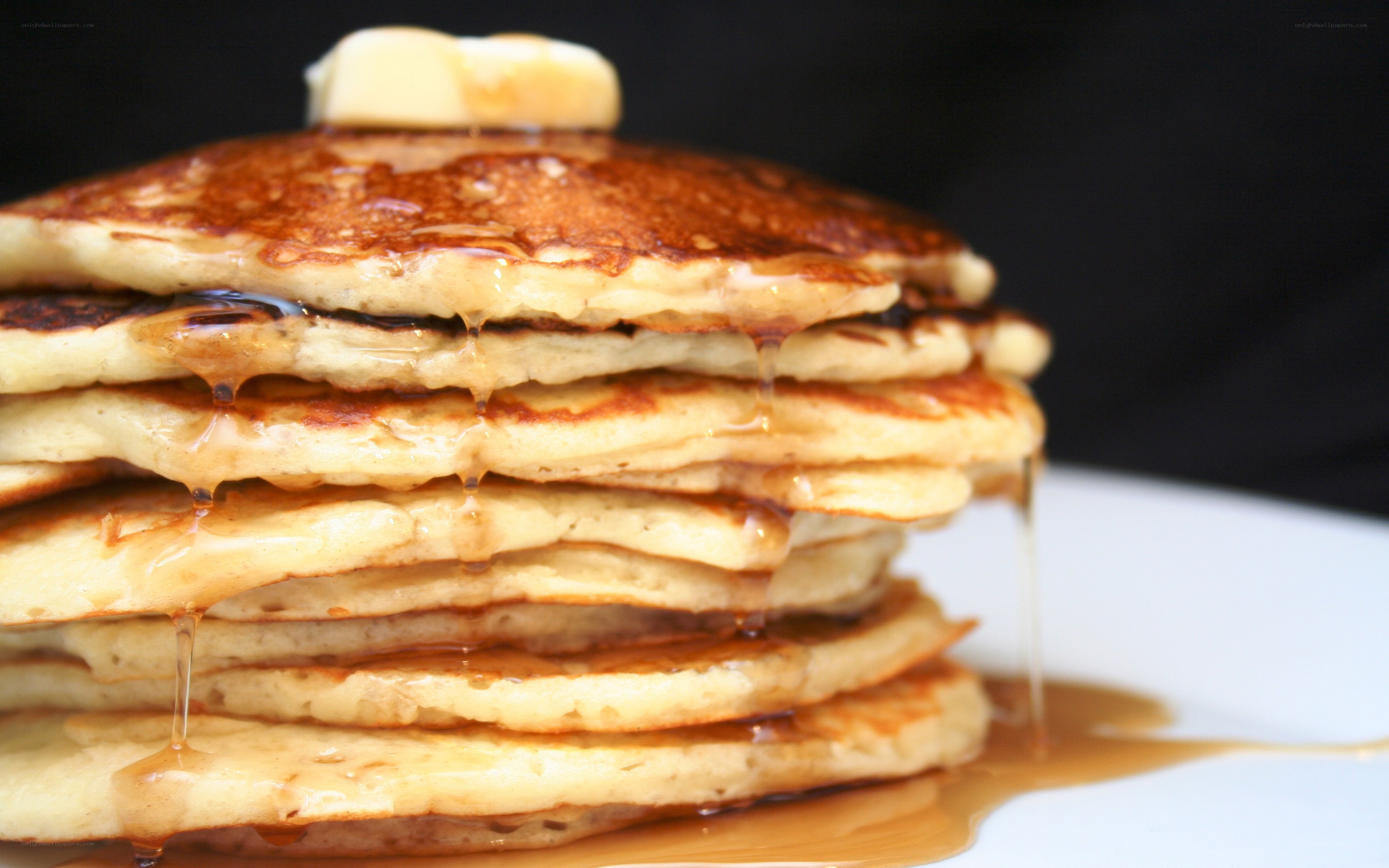 stacked pancakes with syrup