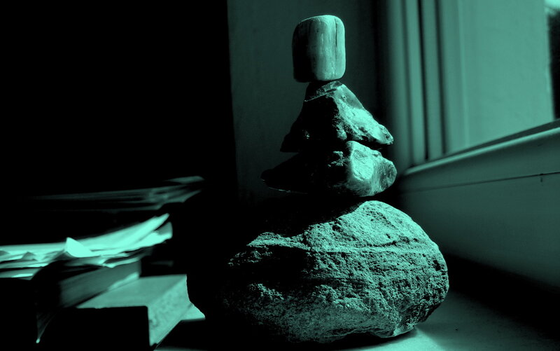 Stacked rocks on windowsill