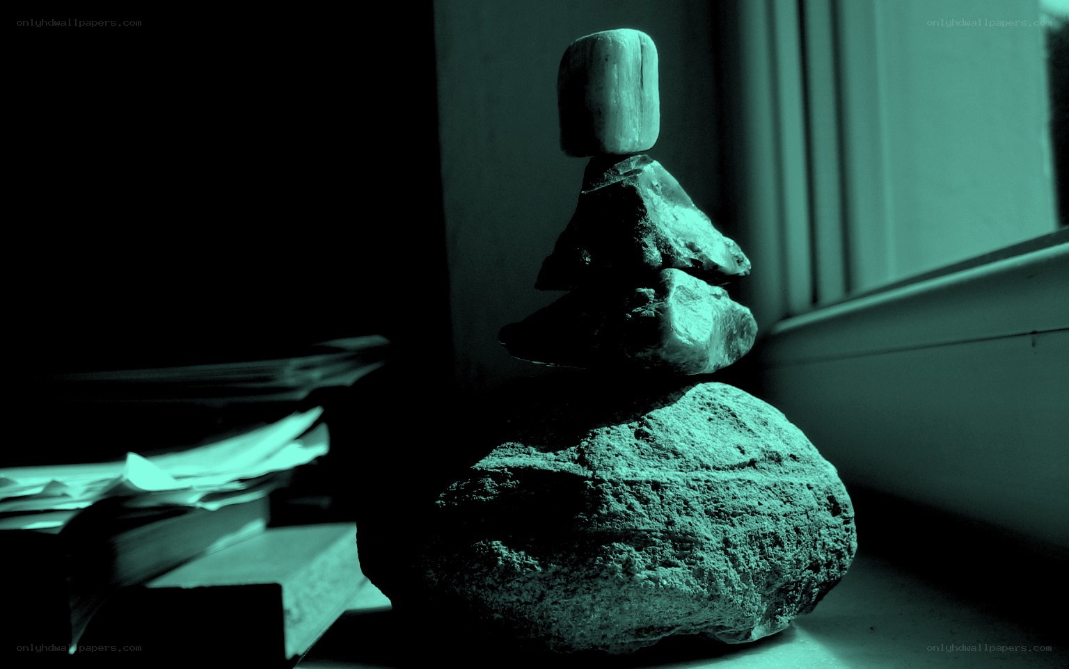 Stacked rocks on windowsill