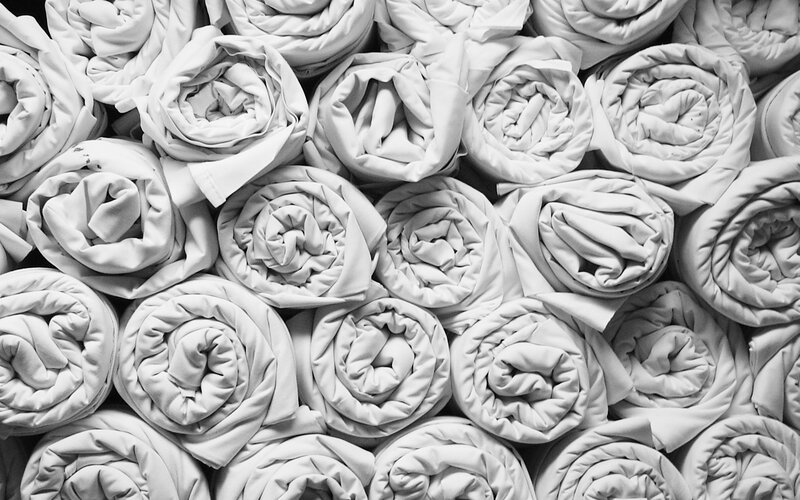 stacked rolled blankets