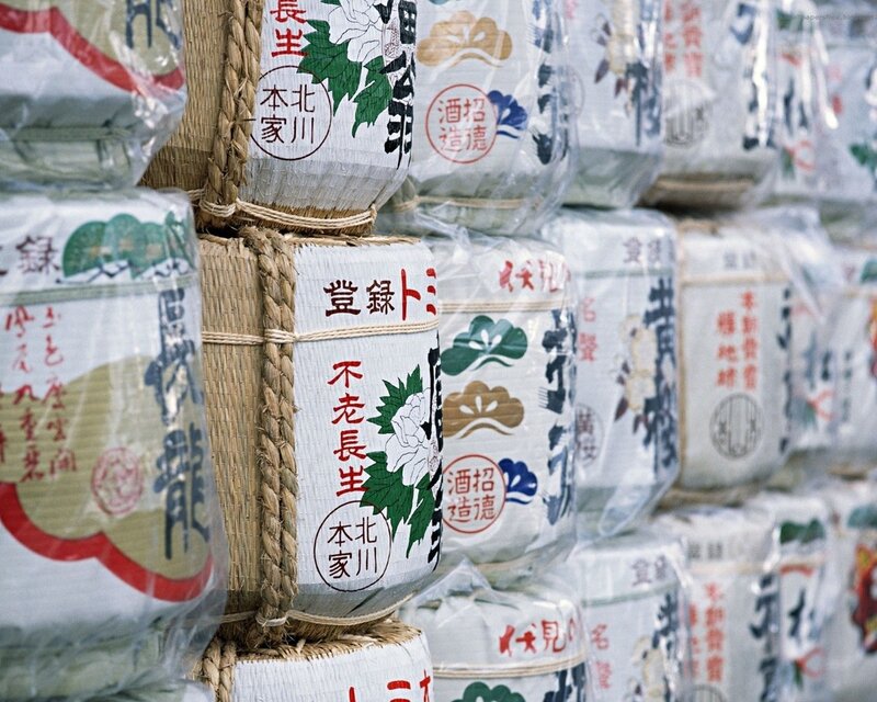 Stacked sake barrels at market
