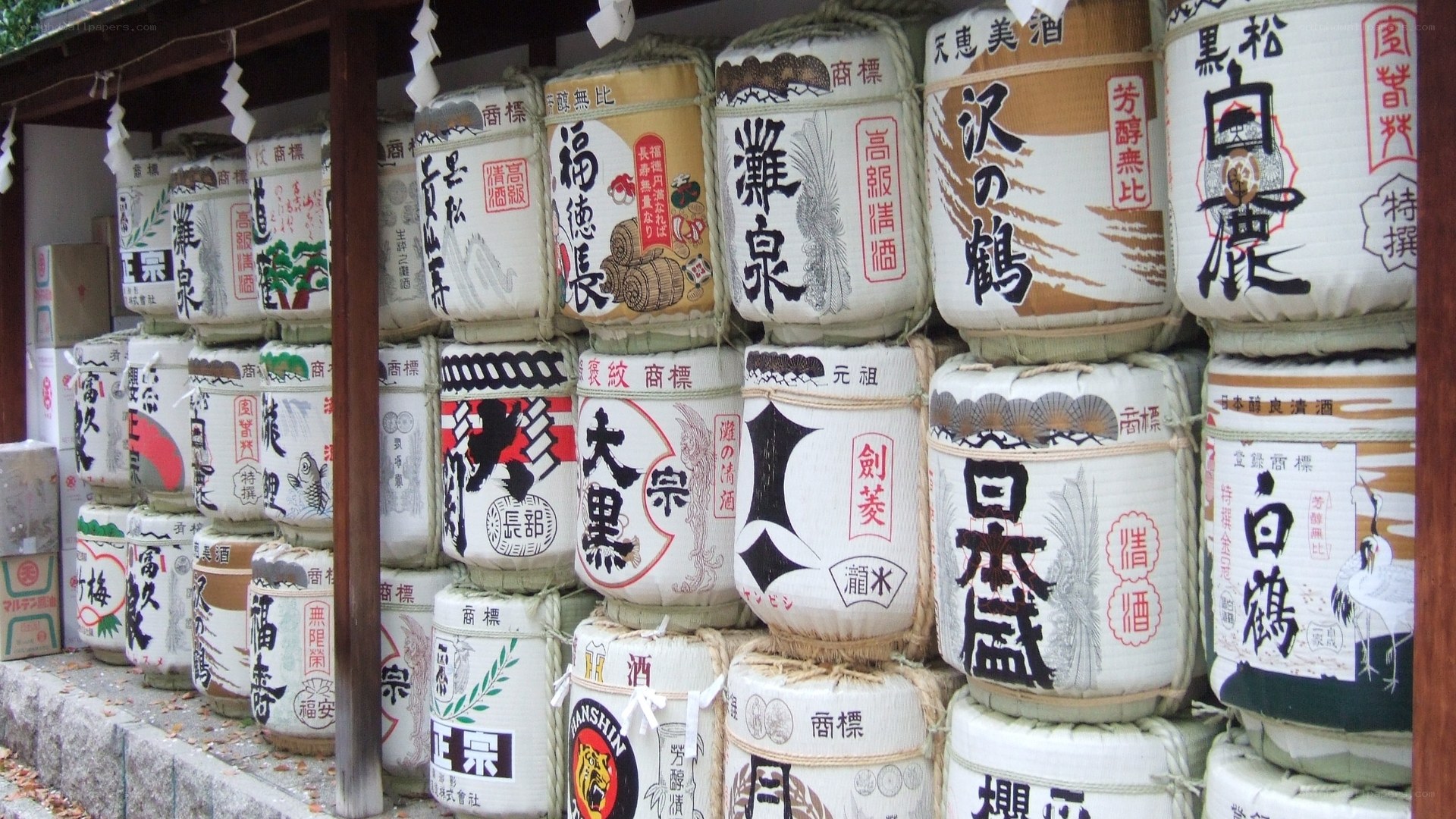 stacked sake barrels at shrine