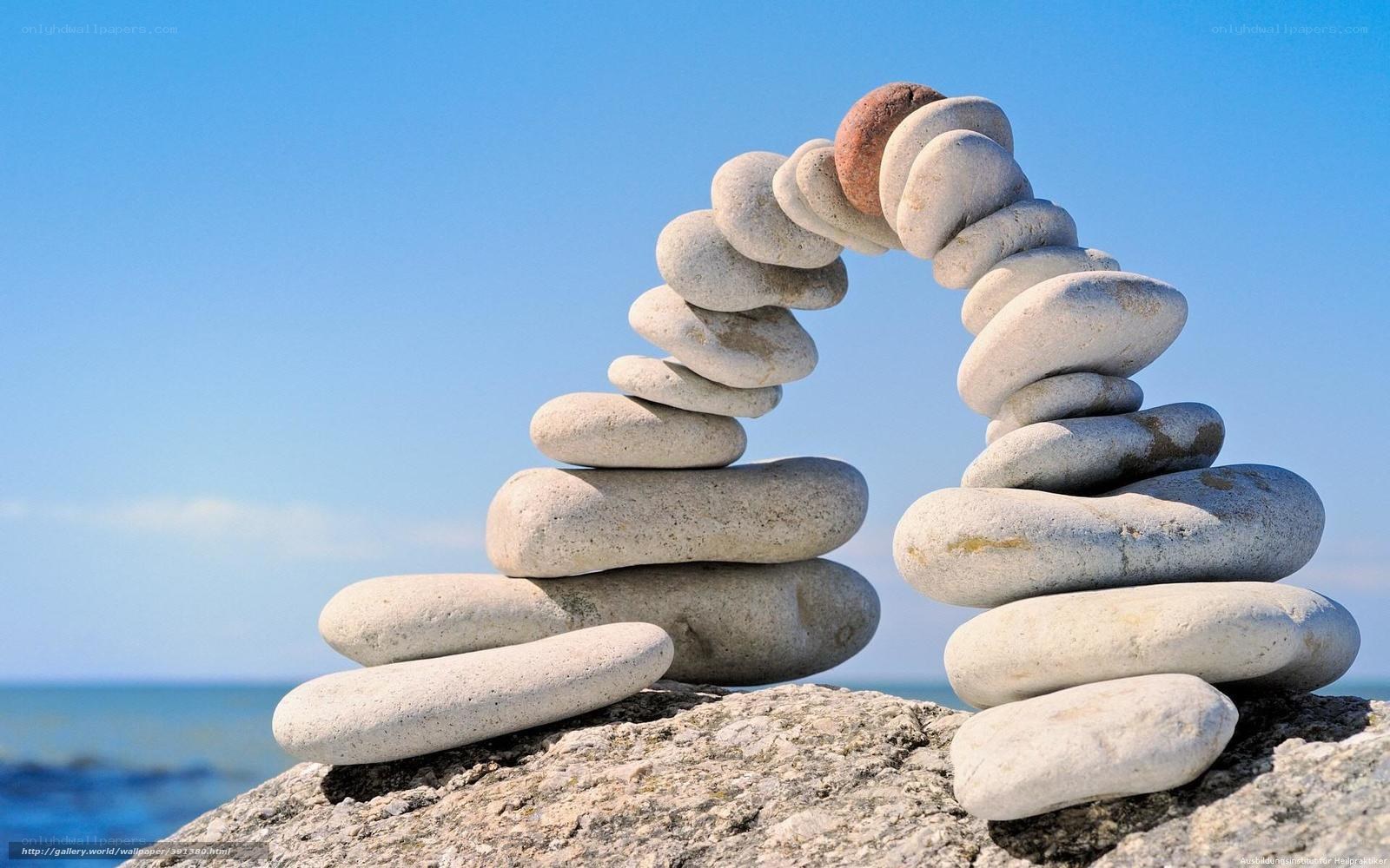 Stacked stones arch on beach