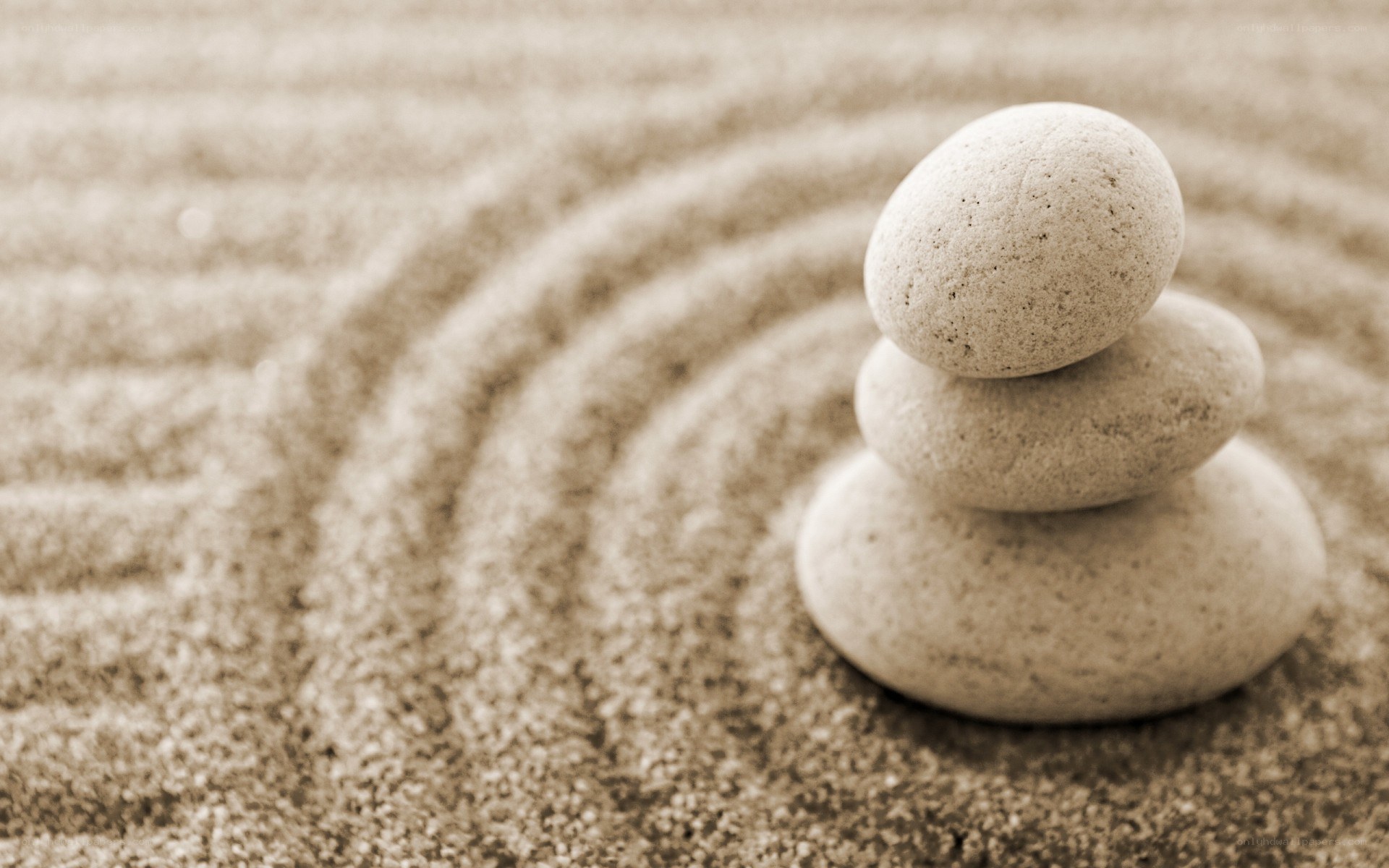 Stacked stones in sand