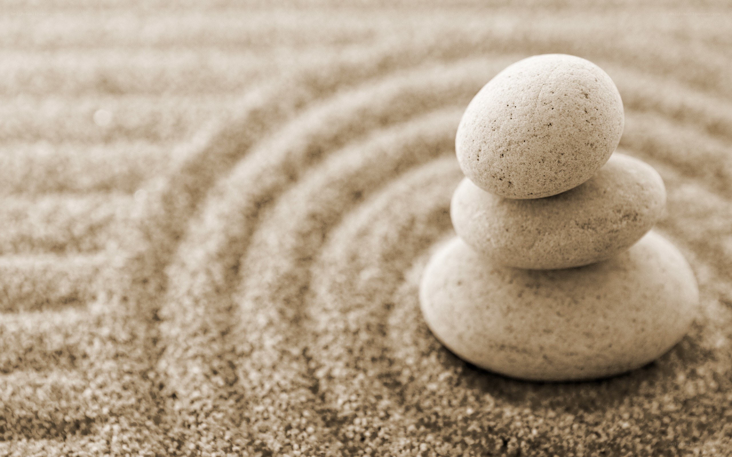 Stacked stones in sand