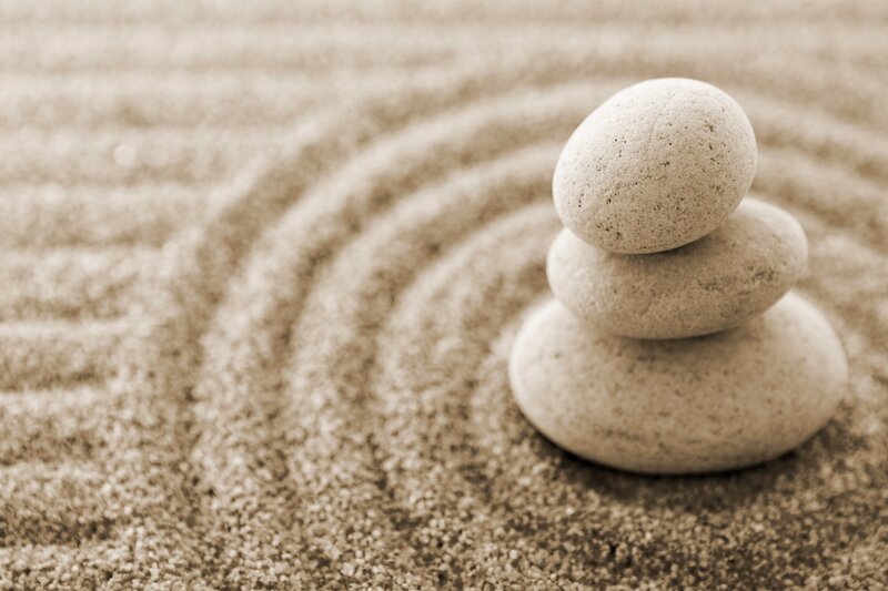 stacked stones in sand