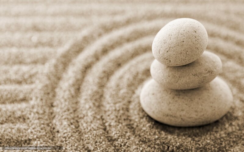 Stacked stones in sand