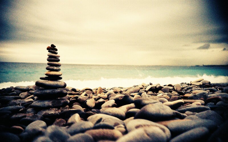 Stacked stones on a pebble beach