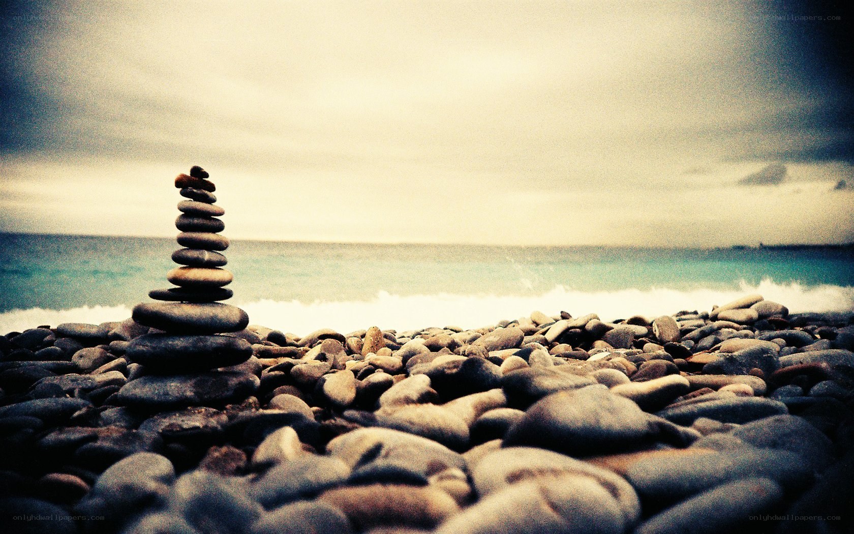Stacked stones on a pebble beach
