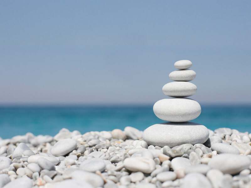 Stacked stones on a pebble beach