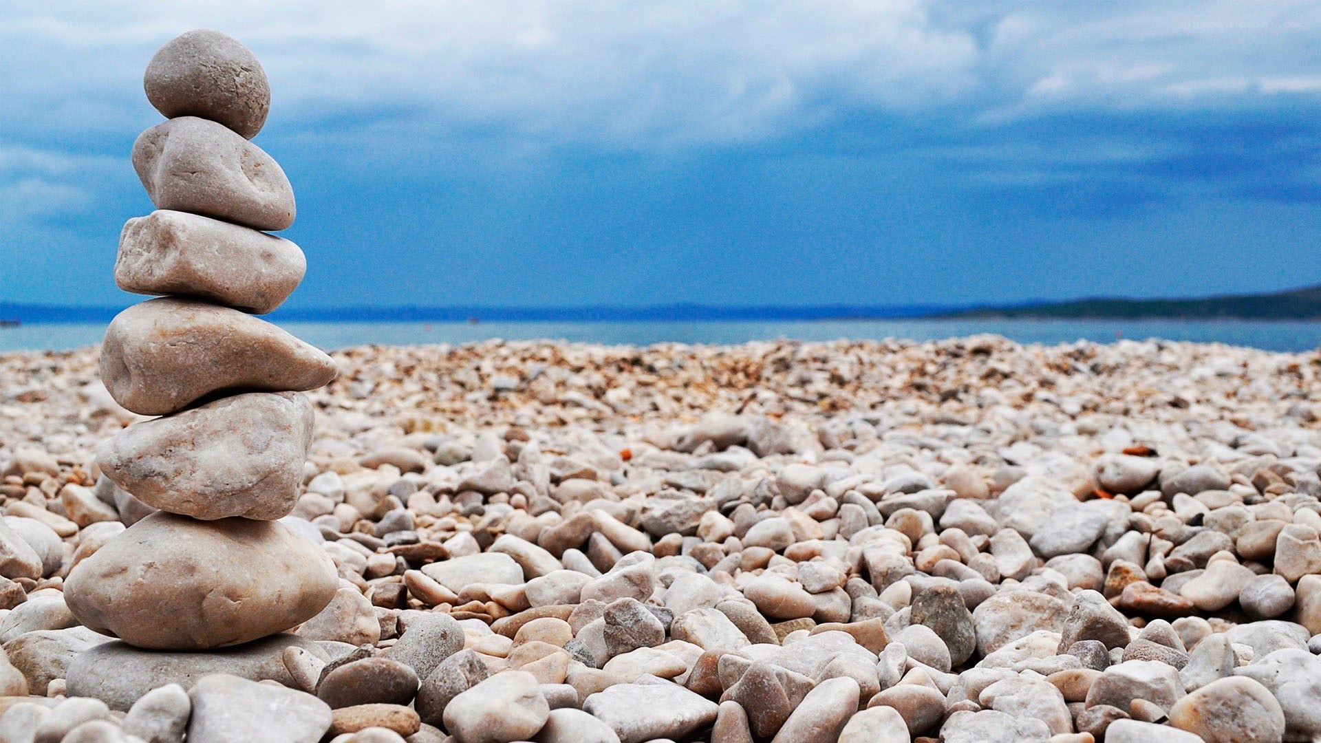 Stacked stones on a pebble beach