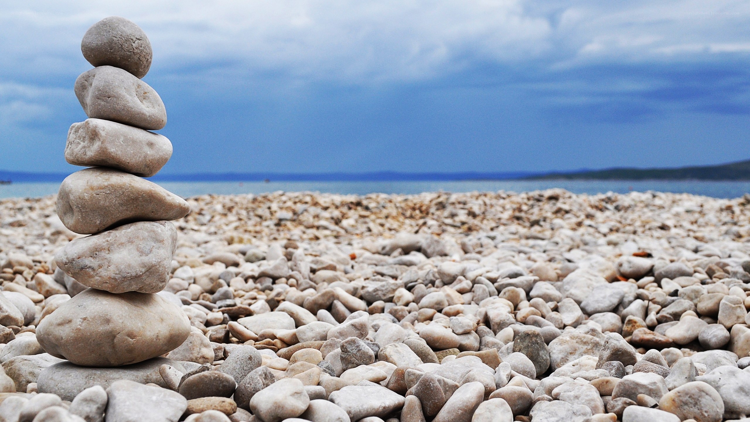 Stacked stones on a pebble beach