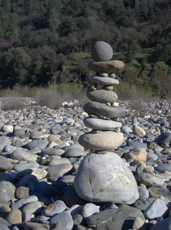 Stacked stones on a riverbank