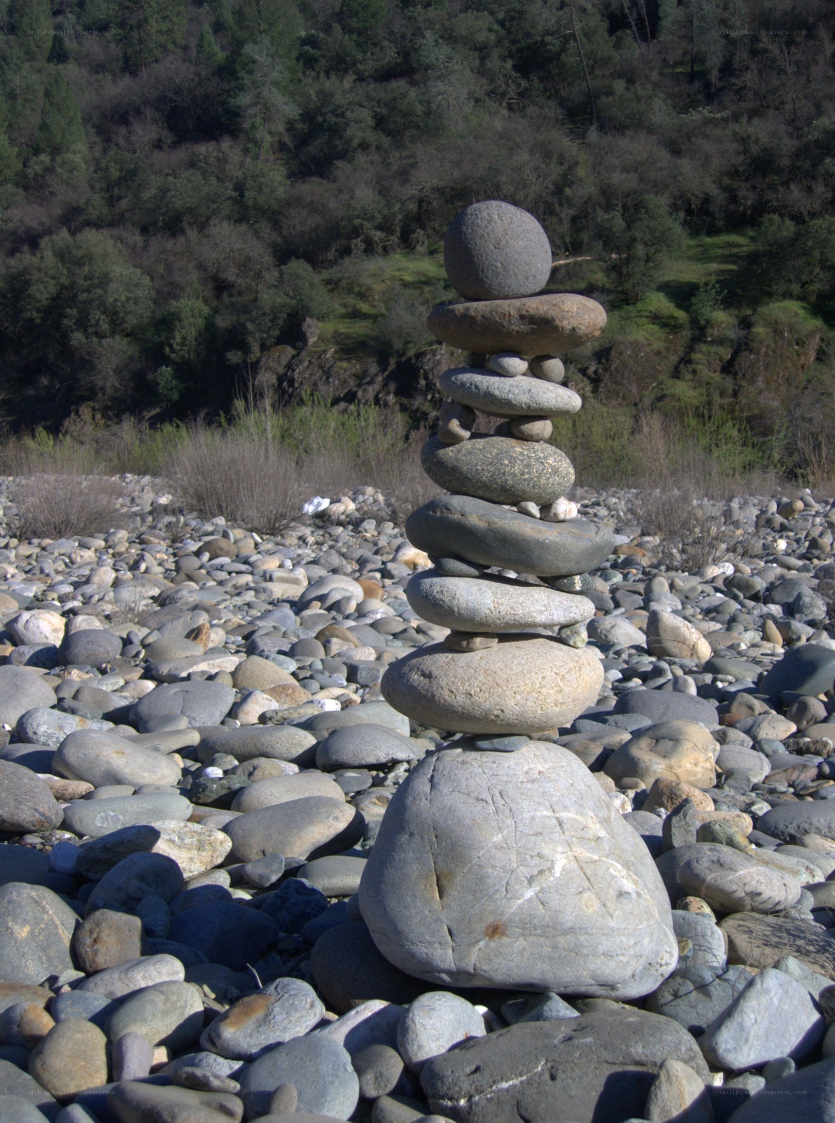 Stacked stones on a riverbank