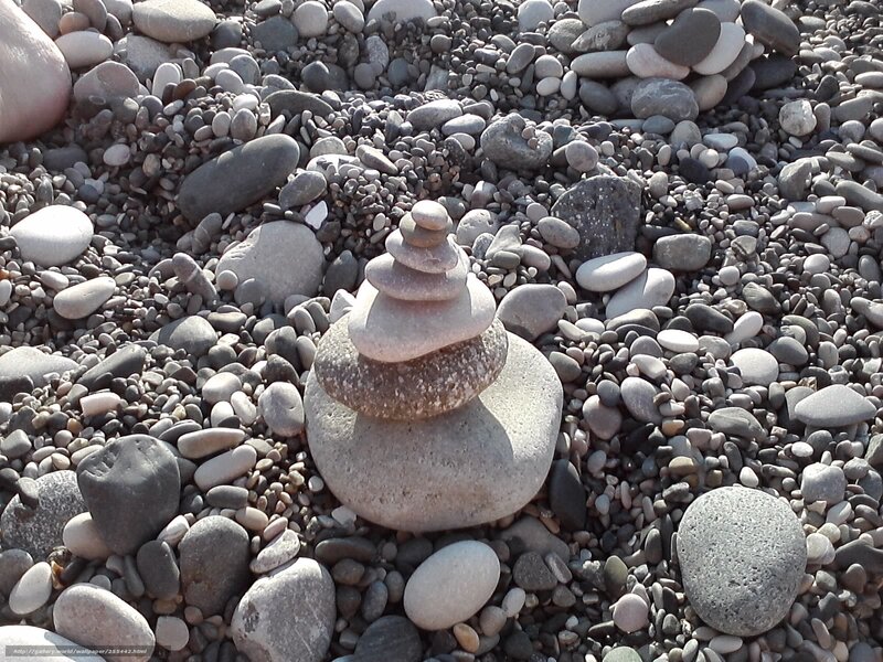 Stacked stones on pebble beach