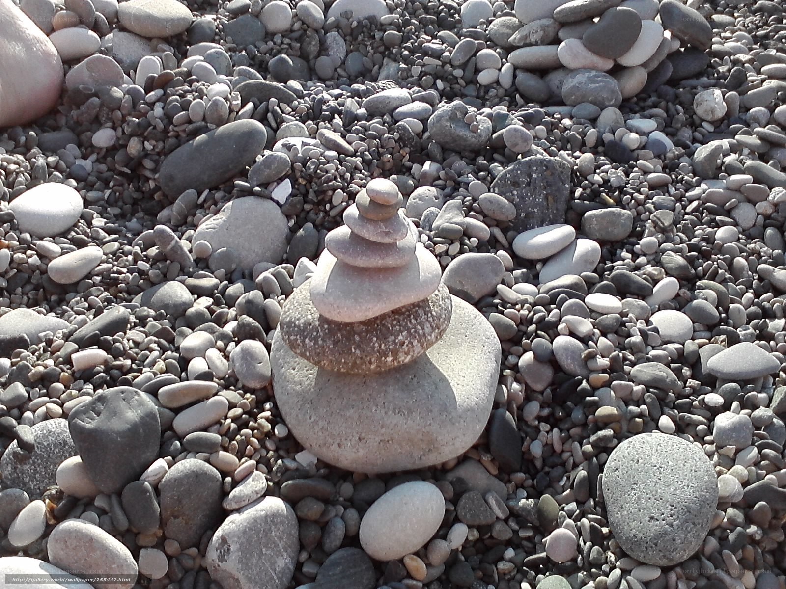 Stacked stones on pebble beach