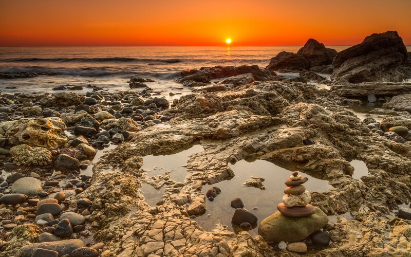 Stacked Stones on Rocks — Orange