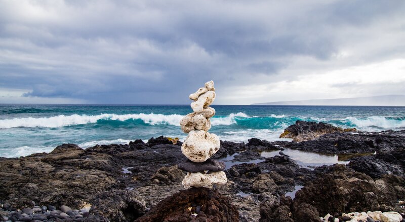 Stacked stones on rocky shore