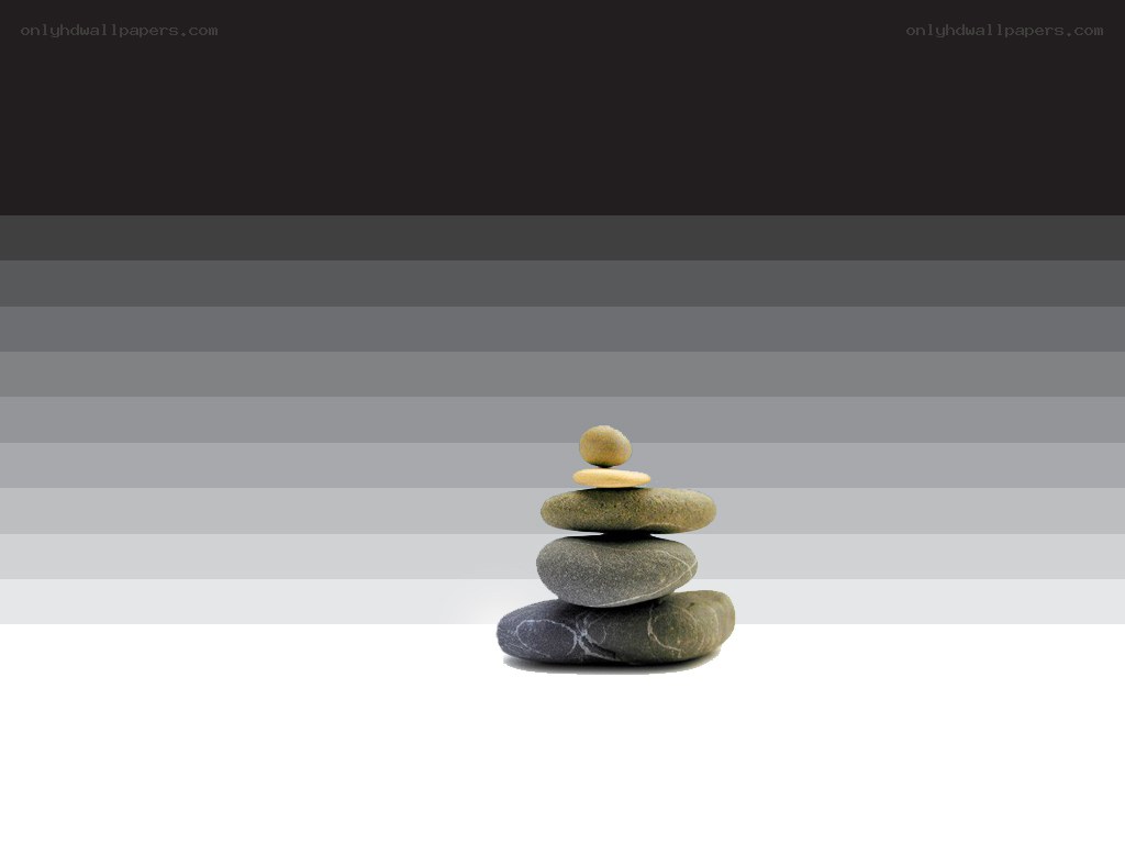 stacked stones on striped background