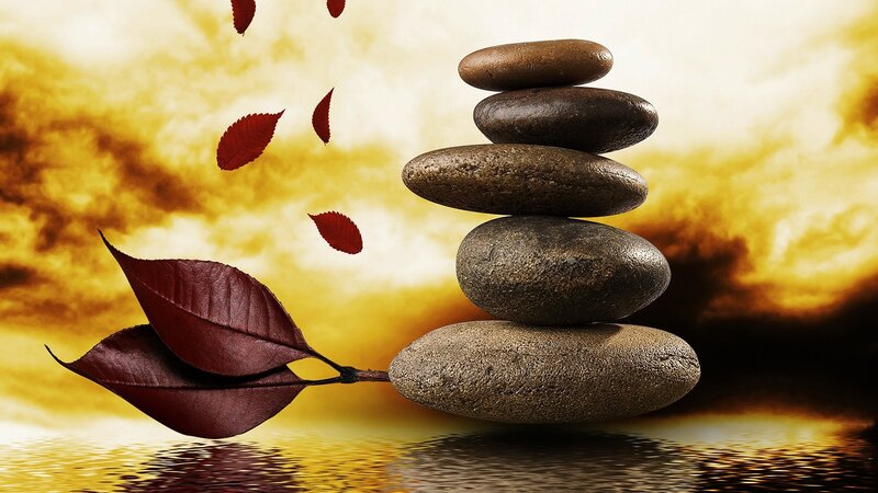 Stacked stones with autumn leaves