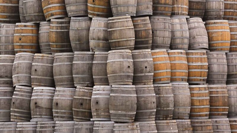 stacked wooden barrels