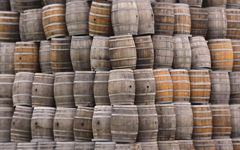 stacked wooden barrels