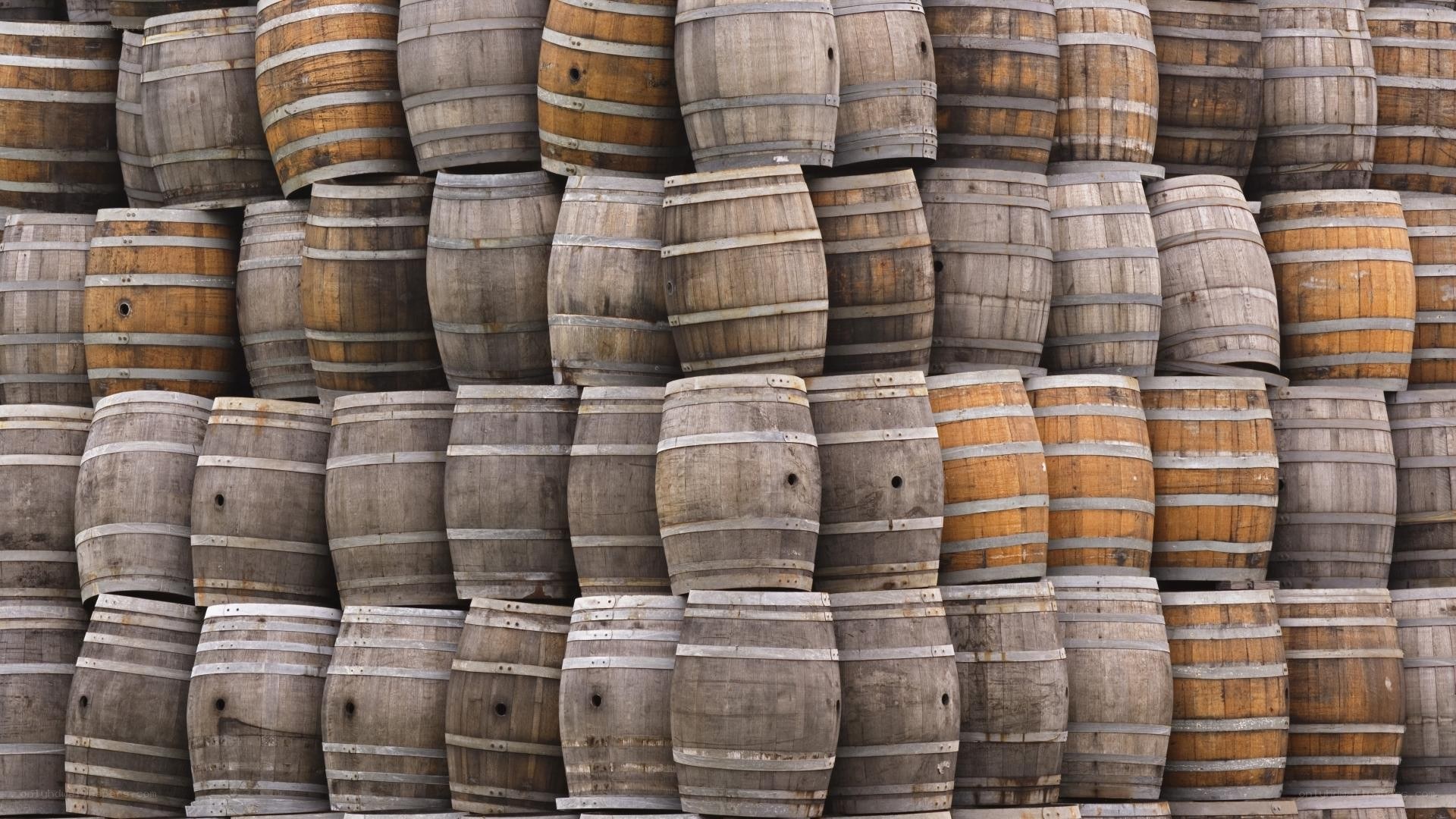 stacked wooden barrels