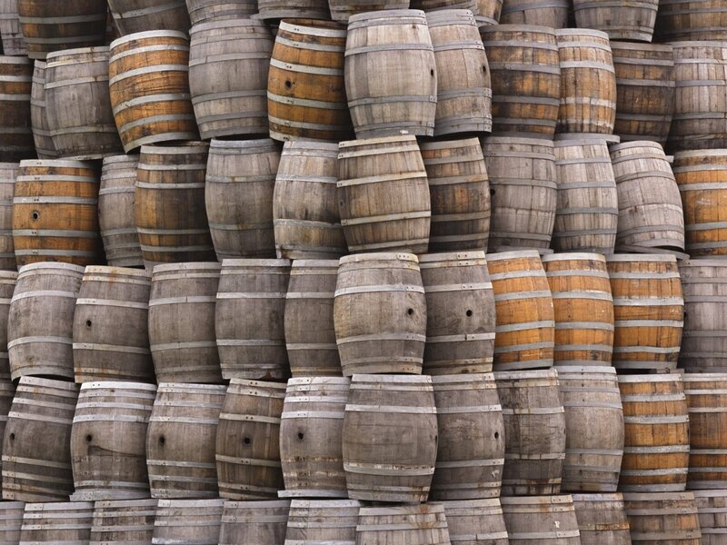 stacked wooden barrels