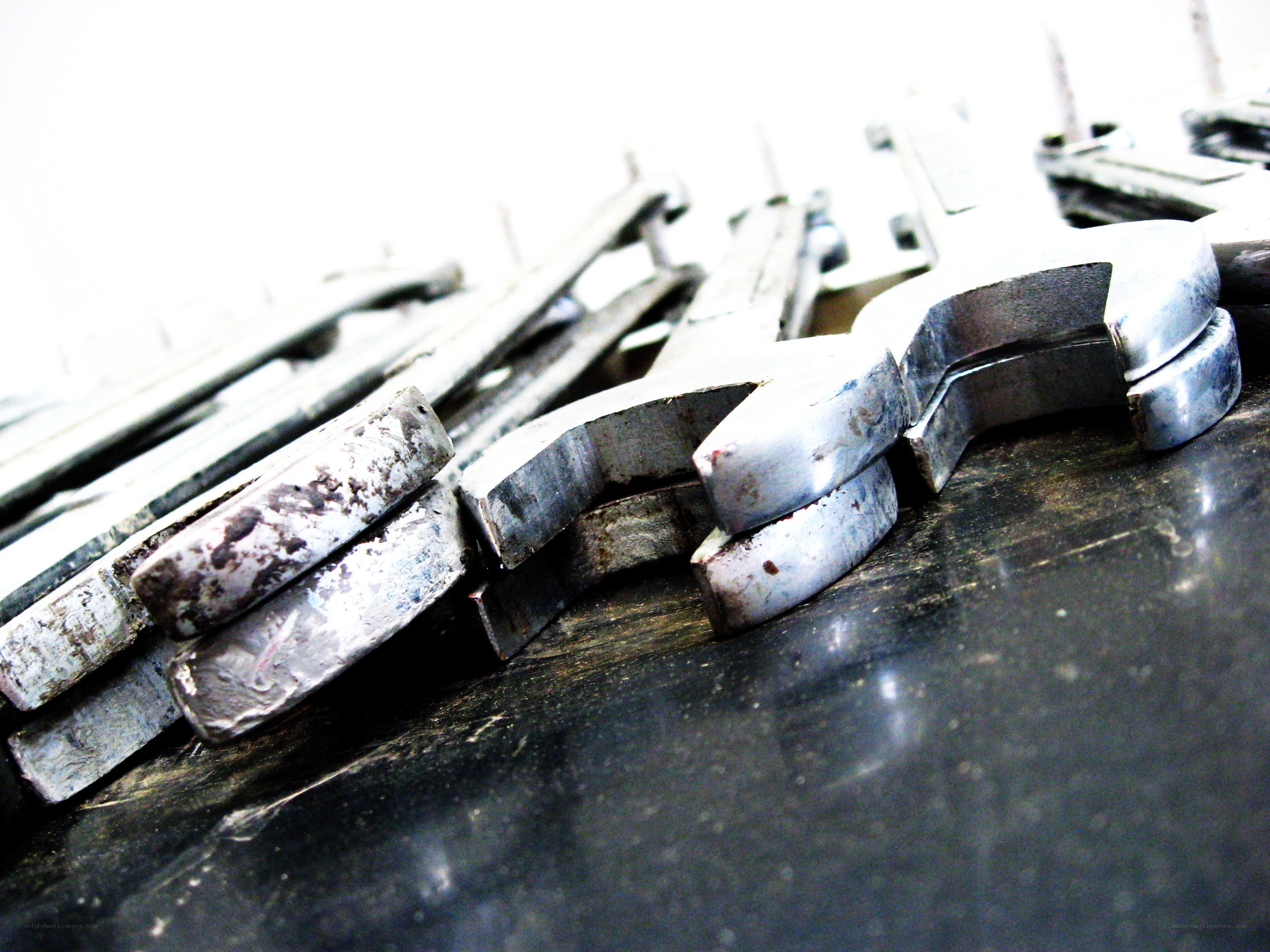 stacked wrenches on surface