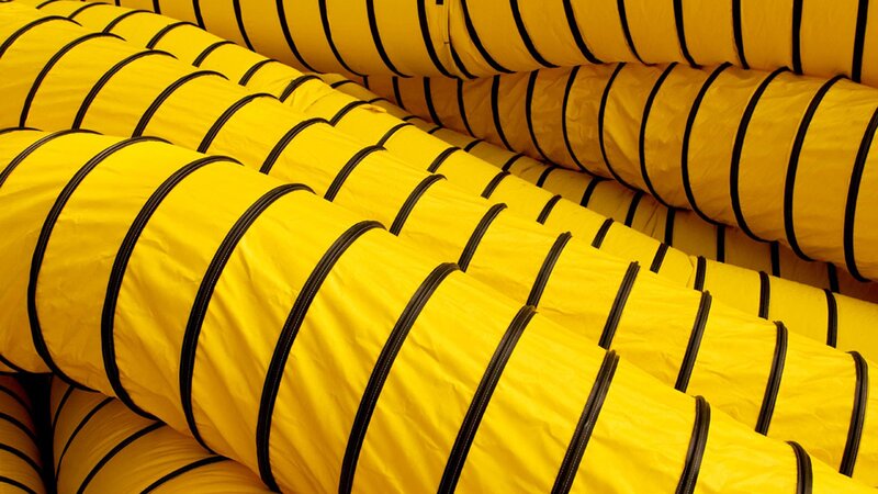 stacked yellow ventilation ducts