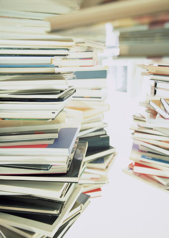 stacks of books in a library