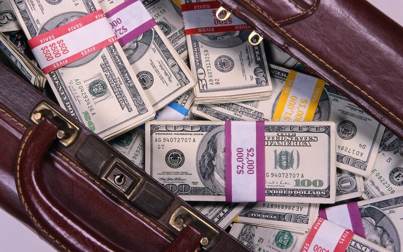 stacks of cash in a briefcase