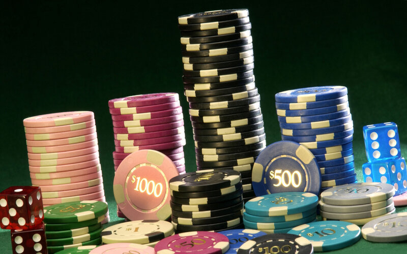 Stacks of casino chips and dice
