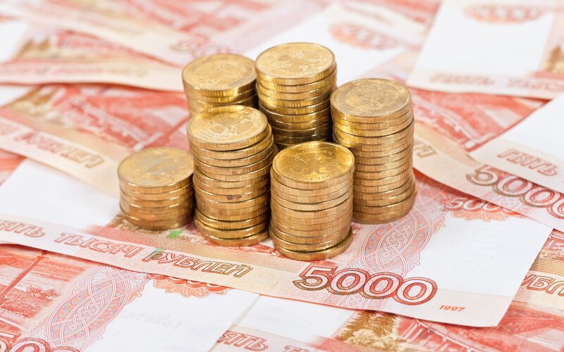 Stacks of Coins on Bills