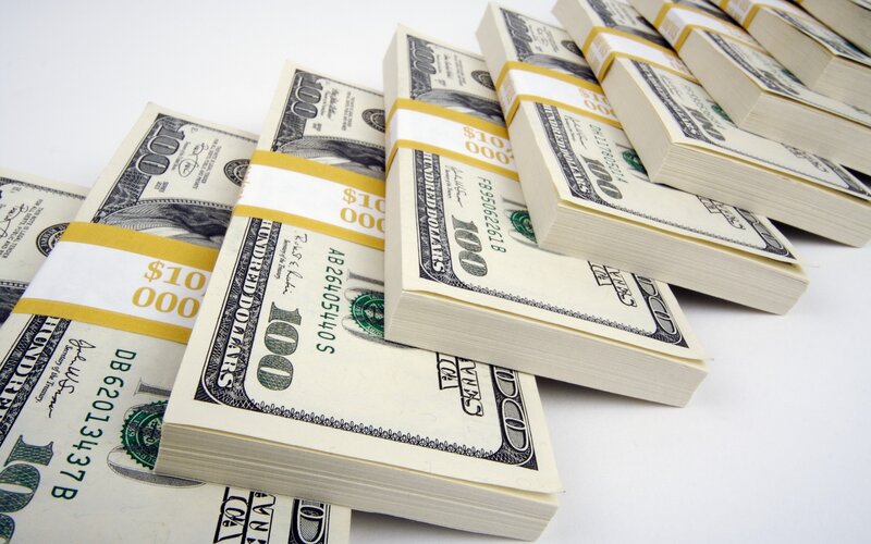 stacks of hundred dollar bills