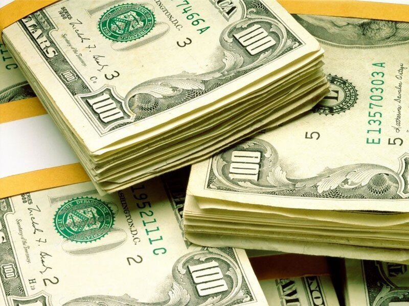 stacks of hundred dollar bills