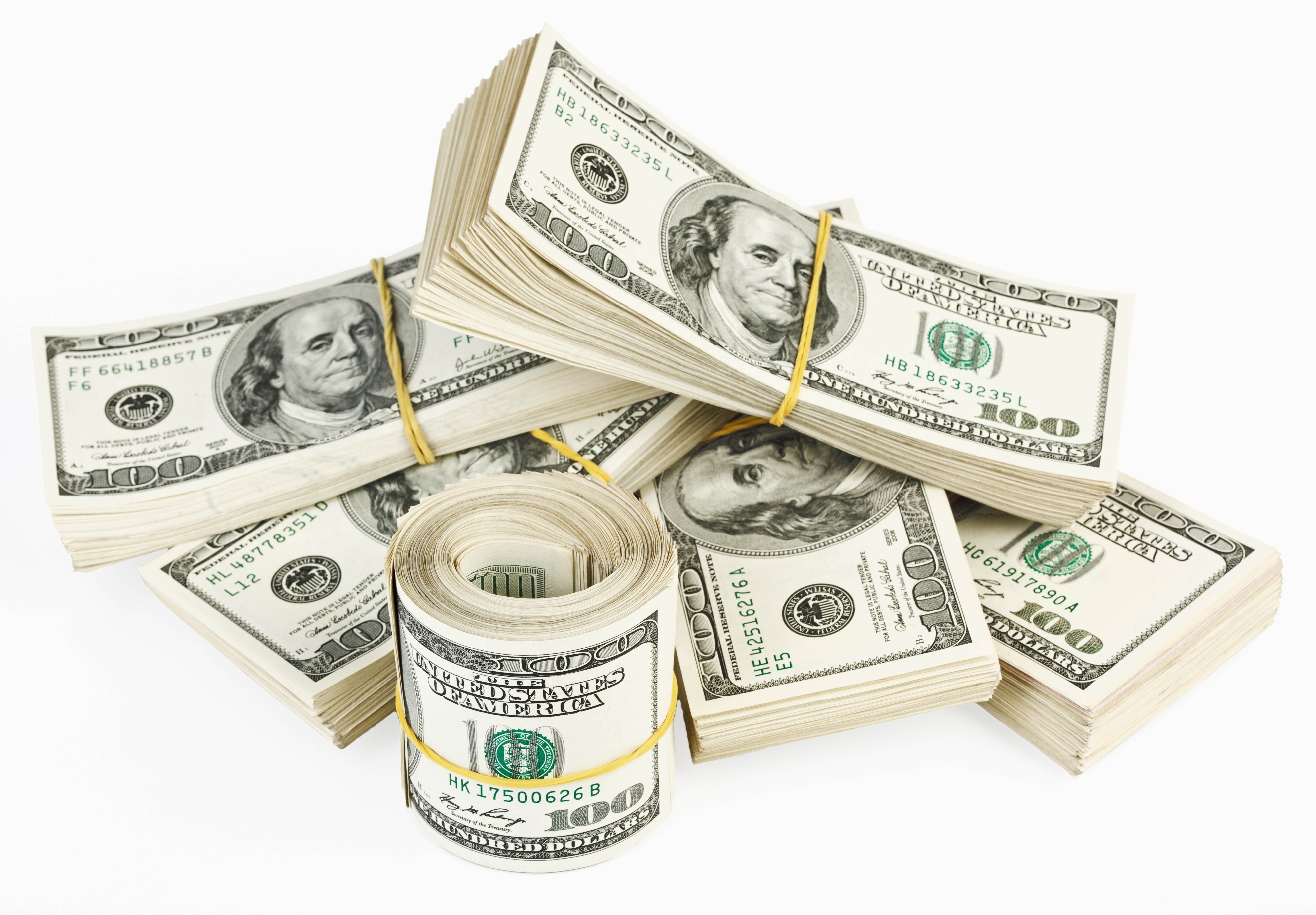 stacks of hundred dollar bills