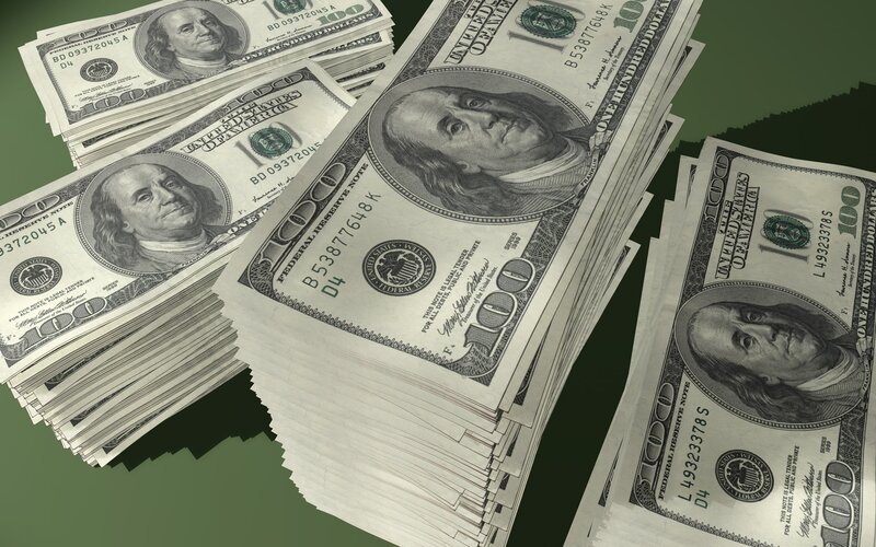 stacks of hundred dollar bills